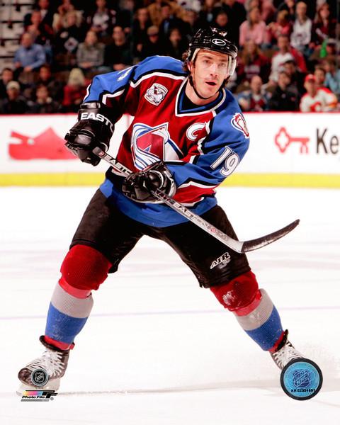 Colorado Avalanches Joe Sakic waves to the cheering crowd in a Quebec Nordiques  jersey during a special presentation before an exhibition game between the  Montreal Canadiens and the Colorado Avalanche on Saturday